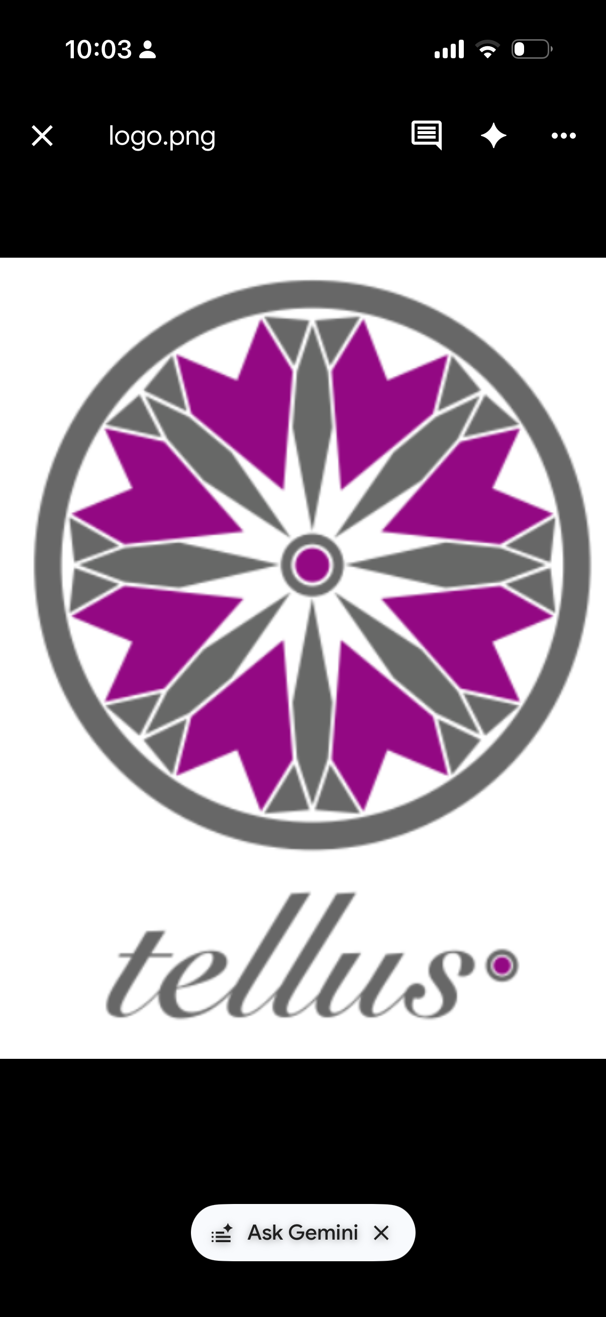 Original Tellus logo: a diamond-cut emblem in magenta and grey